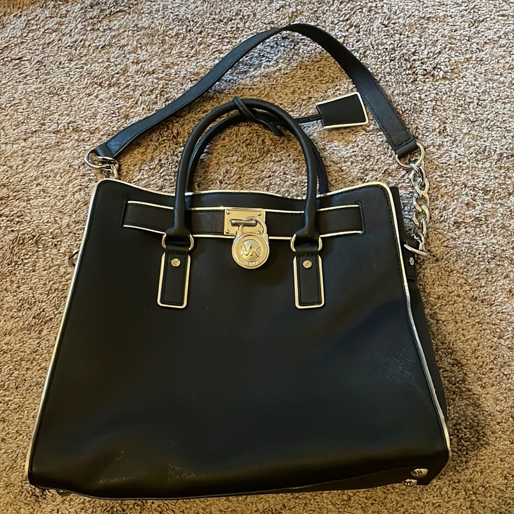 Michael Kors purse. Black and silver. Used but still in good condition.